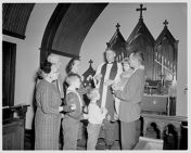 Reverend John Drake with a family 
